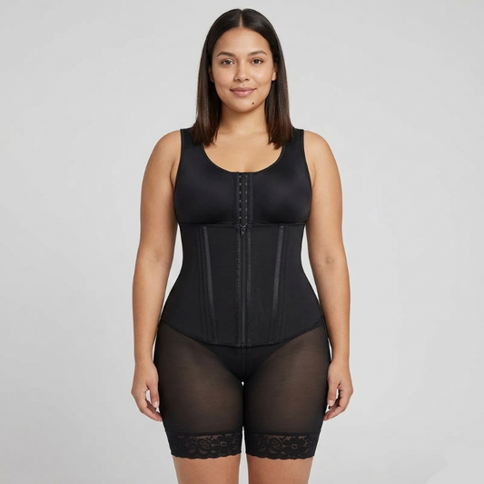 Woman wearing a black waist trainer against a gray background